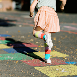 girl doing hopscotch